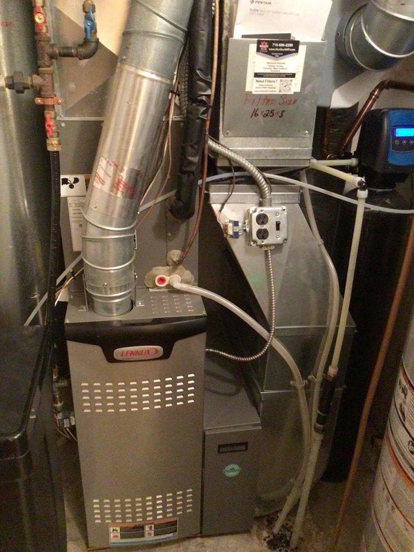 Completed annual AC tune-up on residential Lennox HVAC system and verified unit operating within normal parameters. Identified compressor operational noise concern related to neighbor complaints, determined noise level to be within manufacturer specifications but audible in proximity. Installed insulated compressor jacket to suppress operational noise and minimize sound transmission to surrounding properties.