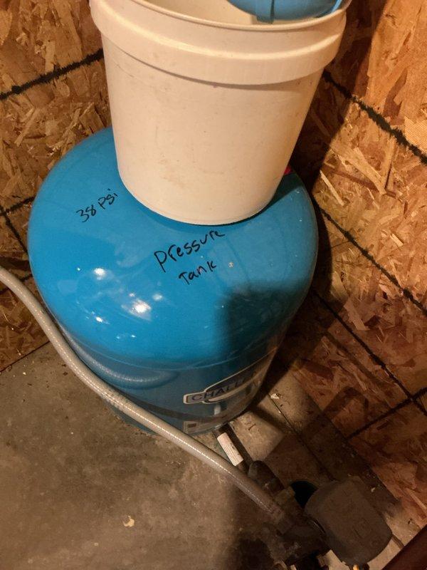 Completed comprehensive annual plumbing inspection of residential system, including examination of water pressure tank (operating at 38 PSI) and associated plumbing connections with brass fittings and valving. All plumbing components, electrical monitoring systems, and pressure regulation equipment were inspected and found to be functioning within normal parameters, with documentation captured for service records.