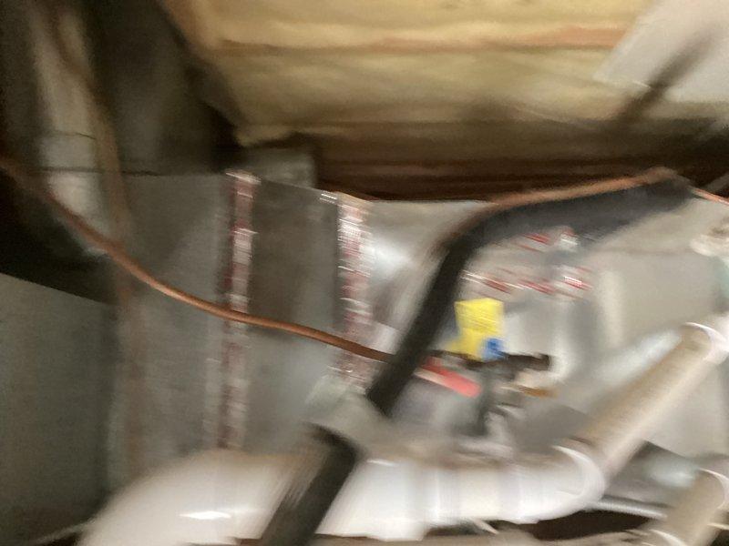 Removed failed evaporator coil from the plenum above the furnace in the attic space. Installed replacement R410A evaporator coil sized appropriately for the 1.5-3 ton system. Reconnected and sealed all ductwork connections to ensure proper airflow. Reconnected condensate drain lines to prevent water damage. Performed pressure test on the refrigerant system to verify integrity of all connections and absence of leaks. Evacuated the system using a vacuum pump and confirmed it held vacuum to manufacturer specifications, ensuring the system was free of moisture and contaminants. Cleaned the outdoor condenser coil to optimize heat transfer efficiency. Charged the system with R410A refrigerant to proper levels per manufacturer specifications. Cycled the system through complete heating and cooling operations. Verified proper system operation including temperature differential, airflow, and refrigerant pressures. System restored to full operational capacity.
