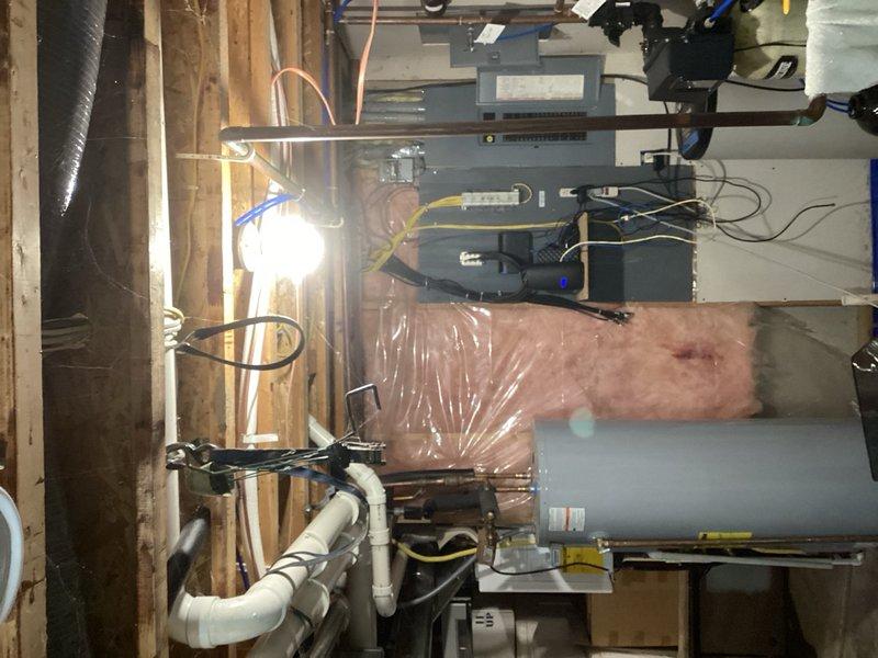 Responded to no hot water complaint on electric tanked water heater. Upon inspection, found tripped breaker and failed upper heating element with visible damage to electrical components. Replaced faulty upper element and restored power to unit. Performed comprehensive electrical testing on both upper and lower heating elements, thermostats, and all associated wiring to verify proper voltage and functionality throughout the system. Confirmed unit began heating properly after repairs. Provided replacement options for future consideration given the unit's history as a warranty replacement and ongoing concerns about equipment longevity at this location.
