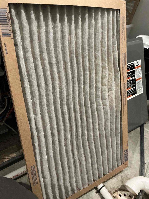 Performed preventive maintenance cooling tune-up on 14-year-old Rheem air conditioning system and dehumidifier unit. Inspected outdoor condenser unit and found contactor, capacitor, fan motor, and condenser coil all in good operating condition with proper refrigerant charge. However, compressor showed signs of failure with extremely elevated high-side pressure readings and excessive amp draw measurements. Indoor air handler inspection revealed clean air filter, functioning control board, and clean evaporator coil, but discovered a significant crack in the heat exchanger at the junction where primary and secondary sections meet. Due to critical safety concerns with the cracked heat exchanger, performed immediate safety shutdown of the heating system to prevent potential carbon monoxide hazards. Documented all findings with diagnostic photos including amp draw measurements and filter condition. Reviewed all available repair and replacement options with homeowner and scheduled follow-up a