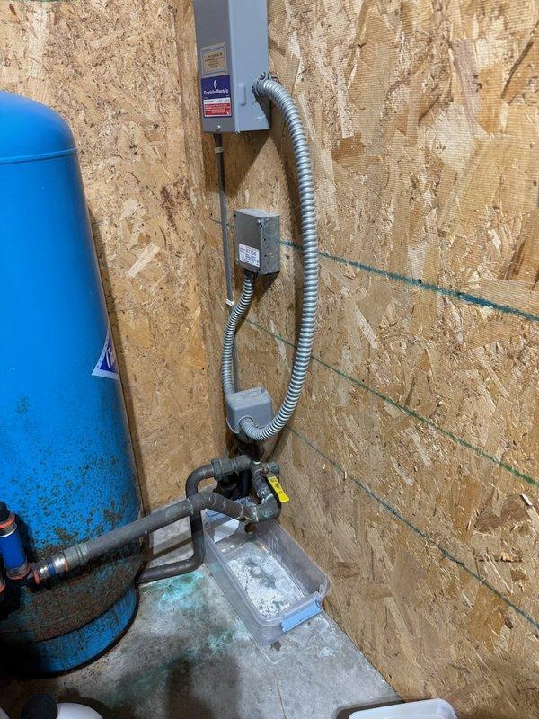 Responded to a water leak at the pressure tank assembly. Upon inspection, identified two leak sources: a faulty pressure switch and a deteriorated ball valve. Replaced the ball valve, pressure switch, pressure gauge, and pressure tank drain valve to restore system integrity and prevent further water damage.