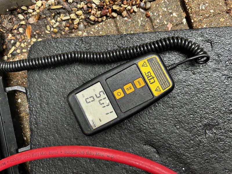 Performed comprehensive AC tune-up on 9-year-old system including operational testing, condenser coil cleaning, and verification of pressures, temperatures, and electrical components. System diagnostics revealed undercharged refrigerant condition; added 12 ounces of R-410A refrigerant and injected UV dye into system for future leak detection. Air filter confirmed clean and all components returned to proper operating parameters.