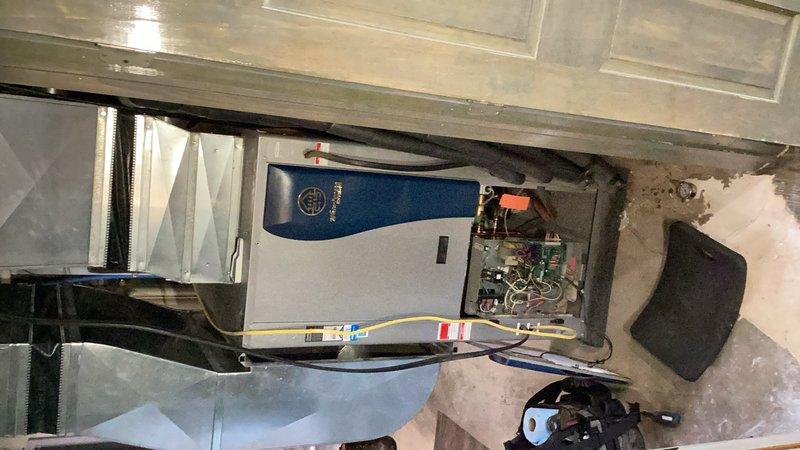 Responded to low compressor error on Water Furnace ENVISION geothermal system that was not cooling. Diagnosed and replaced failed capacitor, then verified proper system operation with 24-degree temperature drop and 6-degree temperature rise across coaxial heat exchanger in cooling mode. Measured ground loop water pressure at 5 psi inlet and 1 psi outlet; loop pressure is slightly low but acceptable given system has operated without maintenance for 17 years.