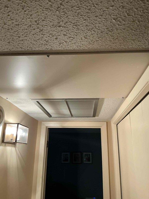 Responded to a no cooling call on an 11-year-old Bryant air conditioning system. Upon arrival, found the thermostat malfunctioning and the blower motor continuously running. Diagnostic testing revealed the system was significantly low on refrigerant charge. Customer reported detecting a refrigerant odor emanating from the indoor unit, suggesting a potential evaporator coil leak. Verified adequate airflow through the system and confirmed all mechanical components were functioning properly aside from the refrigerant loss. Discussed repair options with customer and scheduled a service advisor consultation to review replacement versus repair recommendations given the age of the equipment and suspected evaporator leak.