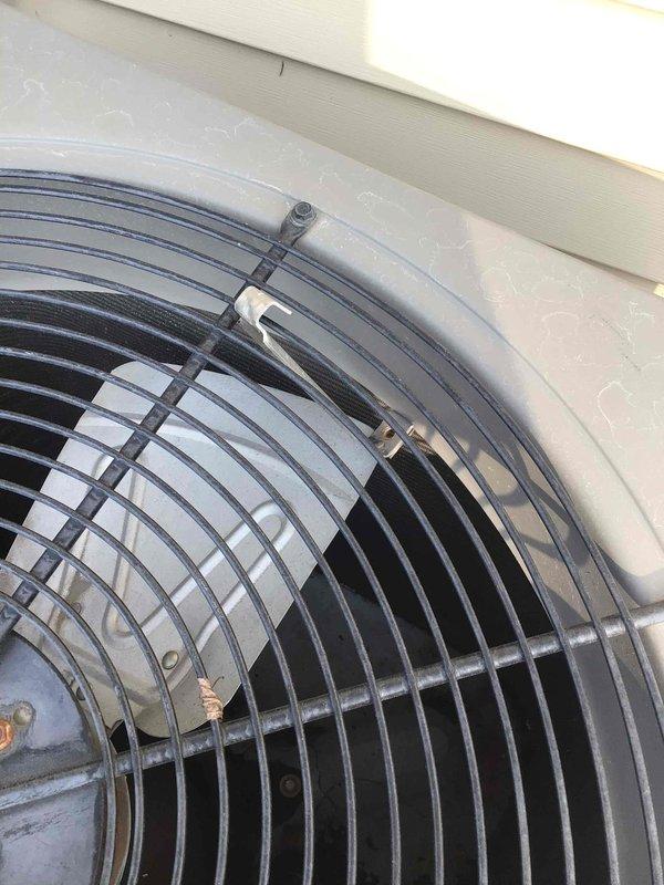 Responded to no cooling complaint on 15+ year old residential air conditioning system. Upon arrival, discovered a gutter bracket had fallen onto the outdoor condensing unit during recent roof work, physically obstructing the condenser fan from spinning. Removed the foreign debris from the unit and verified fan operation. Performed complete electrical diagnostics on the system, confirming all voltage and amperage readings within manufacturer specifications. Measured supply and return air temperatures, verifying proper 20-degree temperature split across the evaporator coil. System restored to normal cooling operation with no additional repairs required.