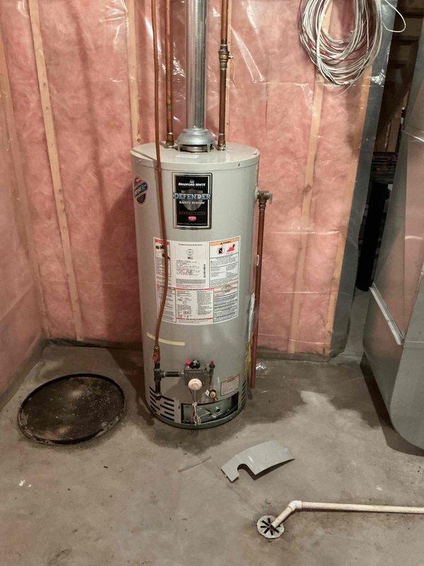Responded to reported leak beneath water heater in basement utility area. Upon diagnostic inspection, confirmed active leak originating from the water heater tank itself, with water accumulating in the drain pan. Dried the area and monitored for continued leakage, which persisted, ruling out alternative leak sources. Determined the tank has developed a breach and requires full unit replacement. Provided estimate for installation of new 40-gallon gas vent water heater. Customer to pursue financing options before proceeding with replacement work.