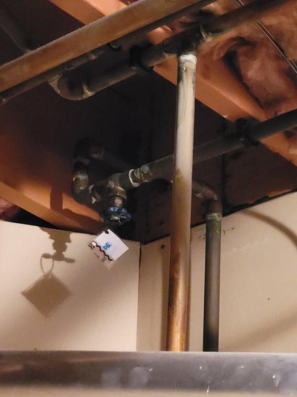 Responded to service call for leaking outdoor spigots and seasonal water system activation. Performed comprehensive plumbing inspection of mechanical room and utility systems. Identified outdated gate-style valves requiring replacement due to deterioration and active leaks. Successfully replaced compromised spigot assemblies with new fixtures and activated water supply to outdoor faucet system for seasonal use. Inspected copper supply lines, zone valves, and associated plumbing infrastructure throughout basement mechanical area. Verified proper operation of replacement spigots and confirmed no additional leaks present in water distribution system. All outdoor water access points now functioning properly with adequate flow and shutoff capability.