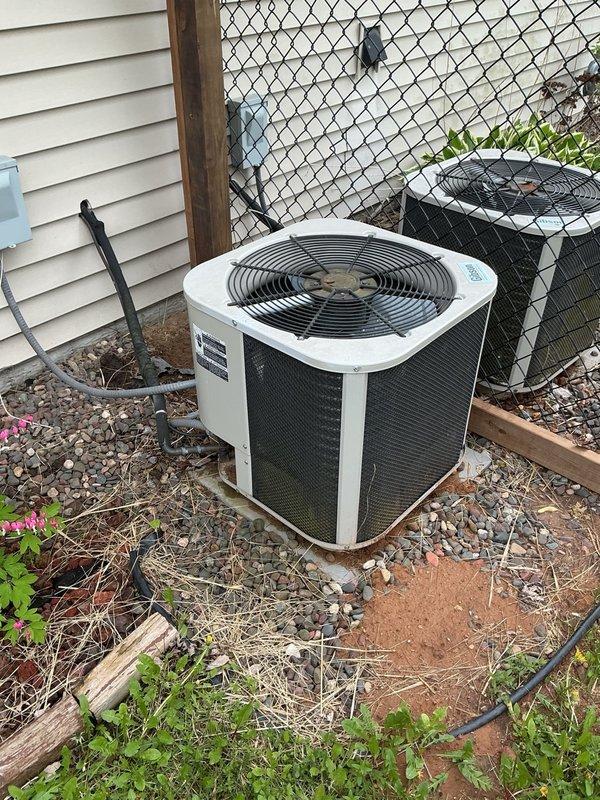 Performed comprehensive air conditioning tune-up and maintenance on residential cooling system. Conducted thorough inspection of all electrical components, verified capacitor reading at proper specifications (35/5 MFD), and cleaned condenser coils to restore optimal heat transfer efficiency. Replaced heavily soiled air filter, confirmed evaporator drain line flowing freely, and verified proper airflow with clean blower assembly. System startup confirmed proper operation with 20-degree temperature split across evaporator coil, indicating unit performing within manufacturer specifications.