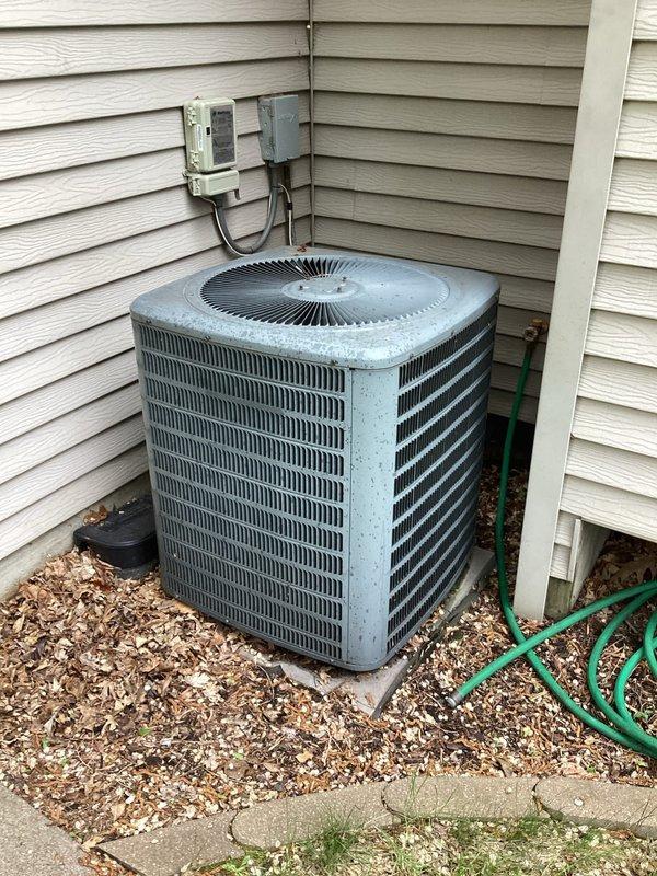 Performed scheduled maintenance tune-up on Goodman air conditioning condenser unit. Conducted comprehensive system inspection including refrigerant level verification, amperage testing, and overall component assessment. All readings were within acceptable operating parameters and unit demonstrated proper cooling performance. Identified and replaced out-of-range capacitor to prevent potential compressor damage and ensure optimal system operation. Verified clean condenser coil and air filter. Confirmed system operating efficiently upon completion of service.