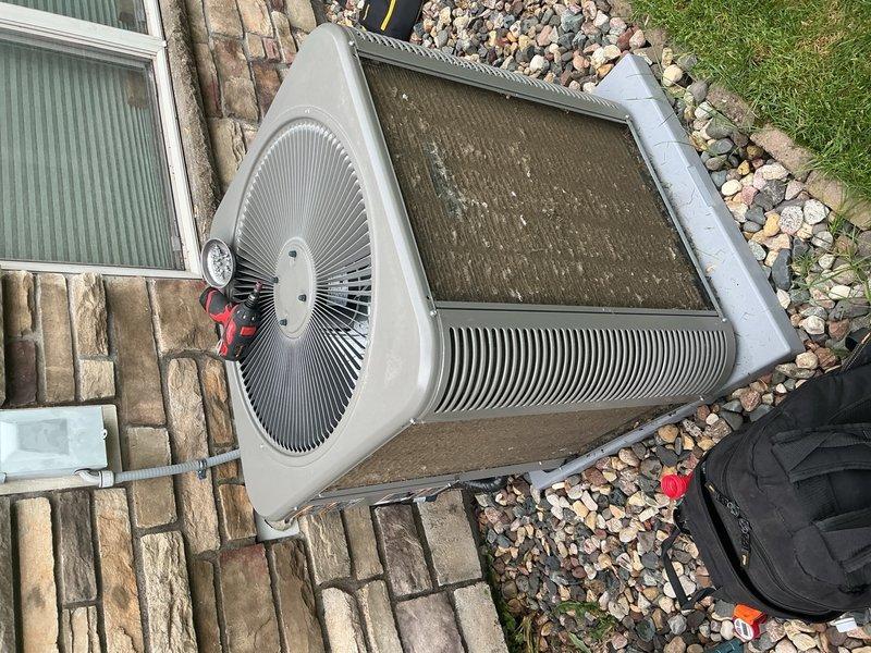 Performed preventive maintenance agreement service on one-year-old residential air conditioning system. Conducted comprehensive inspection and cleaning of outdoor condenser unit, including heat exchanger coils which showed accumulation of debris and organic material on fins. Performed electrical diagnostics using clamp meter to verify proper amperage draw on blower motor circuit and tested all electrical connections. Replaced humidifier system filter as requested. All system components operating within normal parameters with no deficiencies noted.