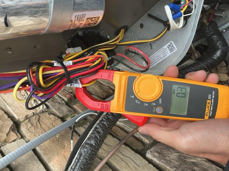 Performed preventive maintenance agreement service on one-year-old residential air conditioning system. Conducted comprehensive inspection and cleaning of outdoor condenser unit, including heat exchanger coils which showed accumulation of debris and organic material on fins. Performed electrical diagnostics using clamp meter to verify proper amperage draw on blower motor circuit and tested all electrical connections. Replaced humidifier system filter as requested. All system components operating within normal parameters with no deficiencies noted.