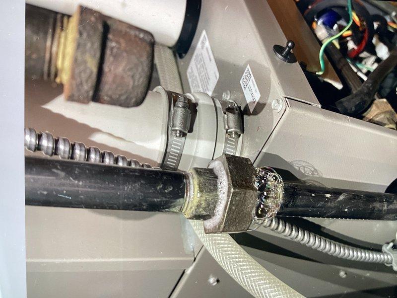 Performed AC tune-up and addressed gas leak in furnace room. Upon arrival, detected natural gas odor that homeowner reported smelling since furnace installation. Located and repaired leaking union fitting on gas line that was previously installed. After completing gas leak repair, proceeded with scheduled air conditioning maintenance service. Cleaned outdoor condenser unit and verified system operation. Measured 22° temperature split across evaporator coil with 55° ambient outdoor temperature, confirming proper cooling performance. System operating within normal parameters; no refrigerant pressure testing required due to satisfactory temperature differential and overall system performance.