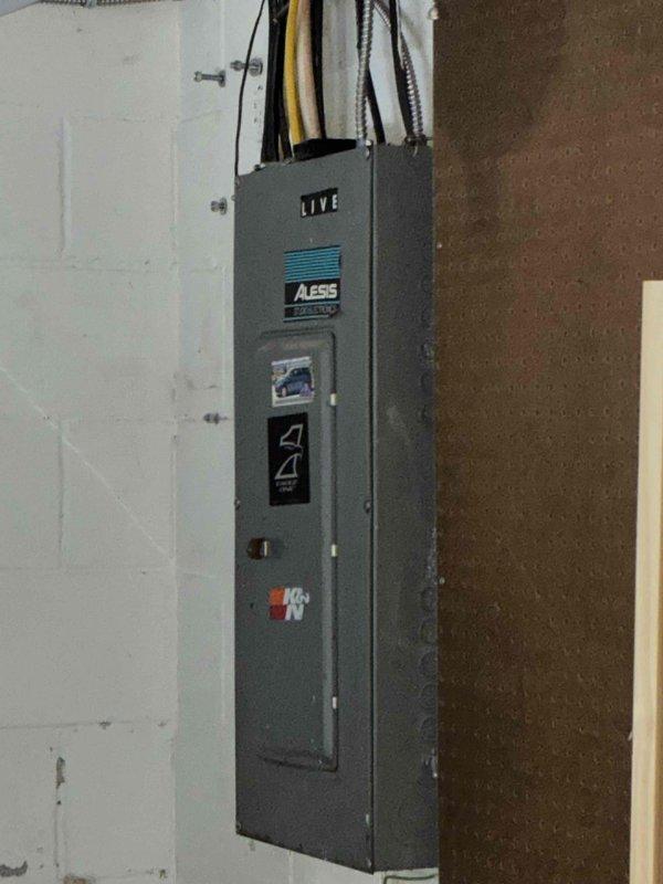 Responded to no cooling complaint on 5-year-old system experiencing buzzing noise and lack of cold air. Found compressor not operating while condenser fan was running, with minimal airflow from outdoor unit. Diagnosed failed capacitor and severely plugged condenser coil. Replaced failed capacitor, performed condenser coil cleaning, and verified fan motor and contactor operation. Replaced plugged air filter and cleared condensate drain line. Verified system operation with 21-degree temperature differential across evaporator coil. Unit restored to proper cooling operation.