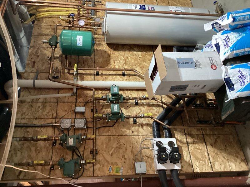 Completed comprehensive maintenance tune-up on 19-year-old geothermal heat pump system per membership agreement. Performed system diagnostics revealing 26° supply temperature with 5° temperature rise across coil in cooling mode, with inlet pressure at 29 PSI and outlet pressure at 45 PSI, indicating proper operational parameters. Flushed condensate drain line, inspected and tested all capacitors and electrical components for proper function. Cleaned air exchanger filters and replaced Space Guard air filter with customer-supplied media. System operating within normal specifications at time of service completion.