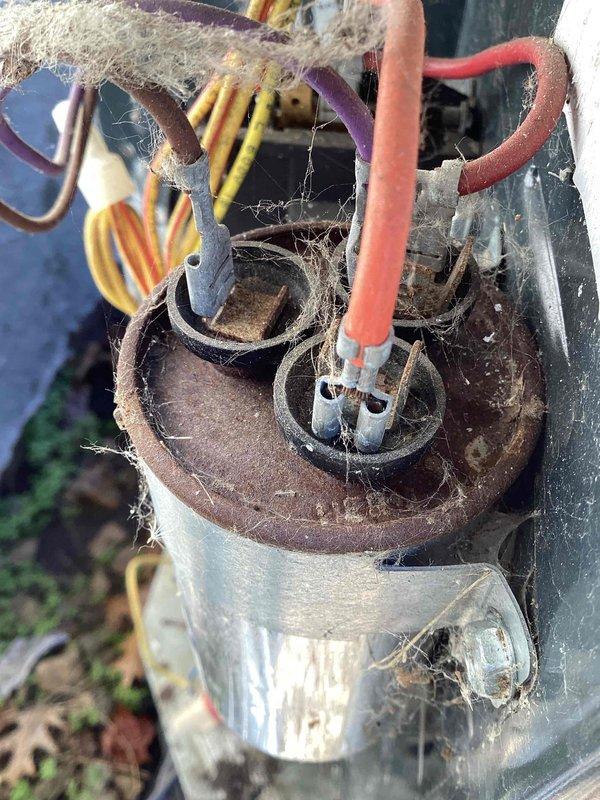 Completed annual cooling maintenance and tuneup on residential air conditioning system. Upon inspection, identified failing contactor with low voltage readings and severe corrosion on compressor terminal housing with heavy debris accumulation. Replaced defective contactor to restore proper system operation. Verified thermostat programming and setpoints functioning correctly at 66°F heat and 78°F cool settings.