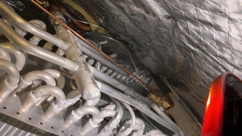 Performed comprehensive annual maintenance on 2-year-old residential air conditioning system per maintenance agreement. Inspected evaporator coil, refrigerant lines, and all HVAC components in mechanical space. Verified proper operation of furnace/air handler unit, checked condensate drainage system, and confirmed all electrical connections were secure. System operating within normal parameters with no issues identified.