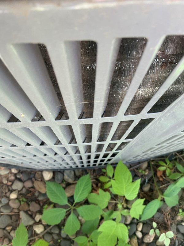 Completed comprehensive AC maintenance tune-up on 1-year-old system per 8-12 agreement protocol. Inspected outdoor condenser unit, verified proper airflow through louvered discharge grate, and confirmed hard start kit operation. System operating within manufacturer specifications with no deficiencies noted at this time.
