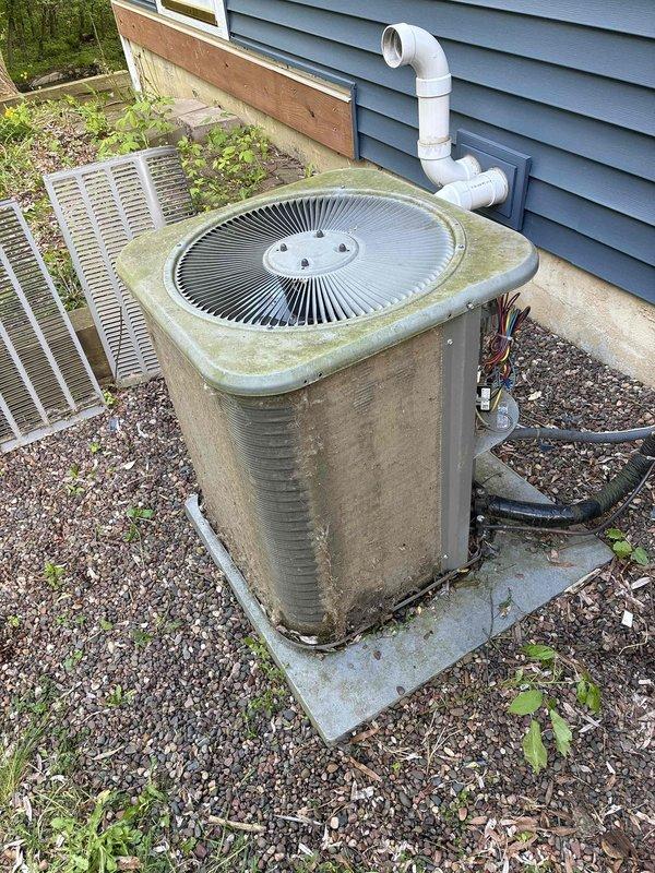 Responded to no cooling call on 10+ year old air conditioning system. Found condenser unit not running with high pressure switch tripped due to severely restricted airflow. Condenser coil was completely plugged with debris, preventing proper heat rejection and causing system shutdown. Reset high pressure switch and thoroughly cleaned condenser coil to restore airflow. Tested capacitor and contactor, both within acceptable parameters. Verified indoor air filter in satisfactory condition. System restarted successfully with 21-degree temperature differential across evaporator coil, confirming proper operation. Unit now cooling effectively and operating within normal parameters.