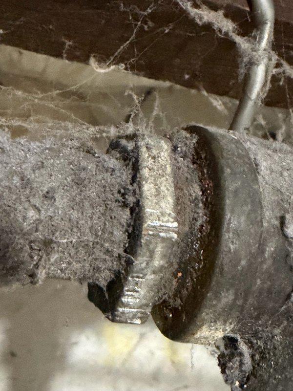 Responded to water leak in basement on main service line located just after the water meter. Upon inspection, identified deteriorated galvanized water line with multiple pinhole leaks causing drips every few seconds along a 5-6 foot section of pipe. Assessed that permanent patching was not viable due to advanced corrosion of the galvanized material. Provided estimate for section replacement and received approval to proceed. Shut off water supply, removed failed galvanized pipe section, and installed new water line using appropriate materials and fittings. Pressure tested replacement section to ensure leak-free operation and restored water service to the home. Discussed future whole-house repiping project with property owner, who expressed interest in phased approach with fixture hookup assistance.