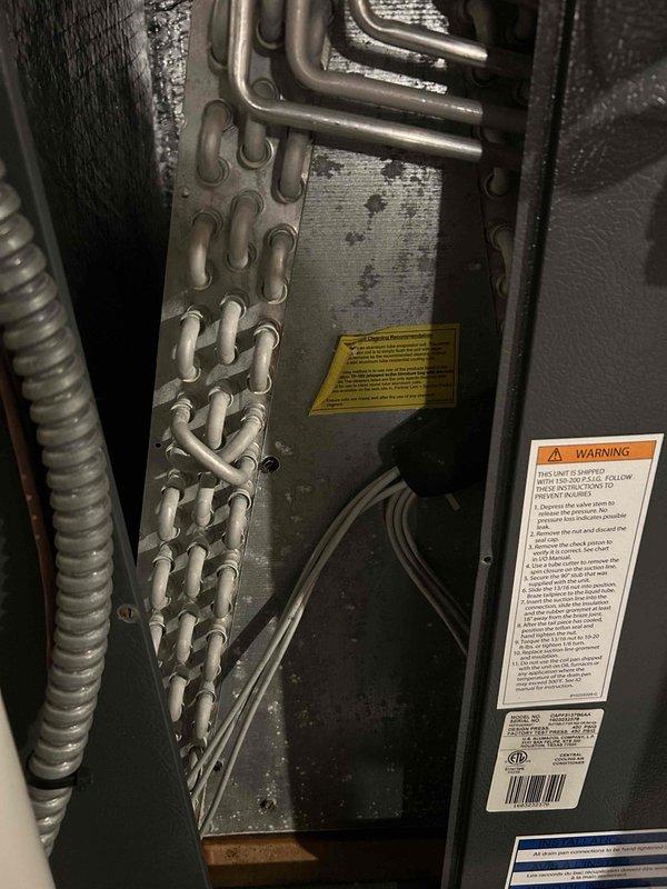 Completed comprehensive AC tune-up on 10-year-old Daikin heat pump system. Performed full inspection of all condenser components, verified all parts operating within manufacturer specifications, and rinsed exterior condenser coil to remove debris. Removed evaporator coil cover for internal inspection, confirmed drain pan was clean and draining properly with no blockages present. Checked air filter condition and found it clean with adequate airflow. Monitored system during full operational cycle and measured 17-degree temperature split across the coil, confirming proper refrigerant charge and system performance. All components functioning correctly with no repairs needed.
