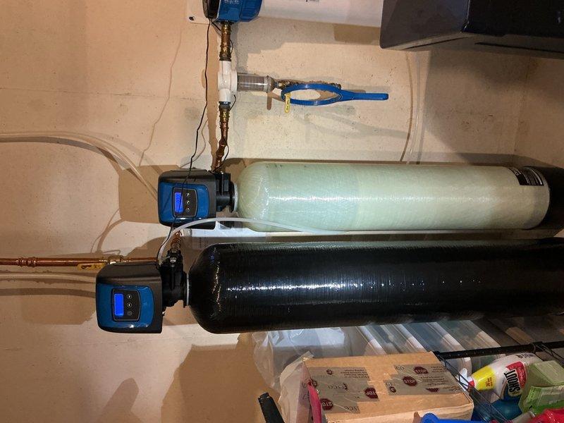 Completed annual plumbing inspection and maintenance on residential property. Replaced iron reduction cartridge in whole house filtration system due to significant plugging and reduced flow capacity. Inspected all visible plumbing fixtures including bathroom toilet, sink, and supply lines for leaks or deterioration. Verified proper operation of dual-tank water treatment system with digital control units and tested all connections. No leaks detected throughout the system. All plumbing fixtures and filtration equipment operating within normal parameters.