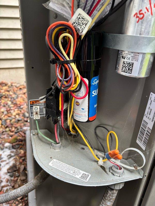 Performed comprehensive cleaning and inspection on 1-year-old air conditioning system responding to customer concerns about occasional grinding noises. Upon arrival, found condenser coil heavily obstructed with accumulated debris, which was thoroughly cleaned to restore proper airflow and system efficiency. Conducted complete system evaluation including electrical components, capacitor, blower motor, and all mechanical connections—all components tested within normal operating parameters. Customer reported hearing intermittent noises in ductwork rather than from the AC unit itself; advised customer to document noise location and capture video if sounds recur to facilitate accurate diagnosis on potential follow-up visit. System currently operating properly with no mechanical issues detected after cleaning and inspection.