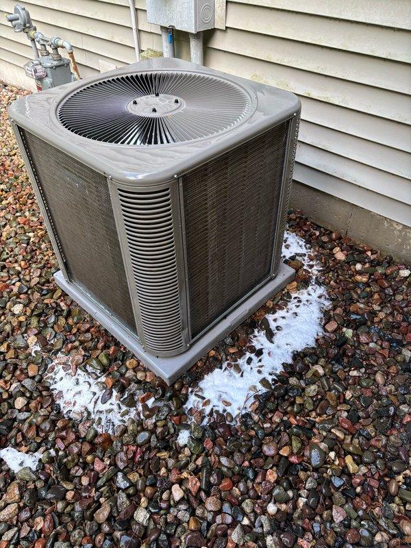 Performed comprehensive cleaning and inspection on 1-year-old air conditioning system responding to customer concerns about occasional grinding noises. Upon arrival, found condenser coil heavily obstructed with accumulated debris, which was thoroughly cleaned to restore proper airflow and system efficiency. Conducted complete system evaluation including electrical components, capacitor, blower motor, and all mechanical connections—all components tested within normal operating parameters. Customer reported hearing intermittent noises in ductwork rather than from the AC unit itself; advised customer to document noise location and capture video if sounds recur to facilitate accurate diagnosis on potential follow-up visit. System currently operating properly with no mechanical issues detected after cleaning and inspection.