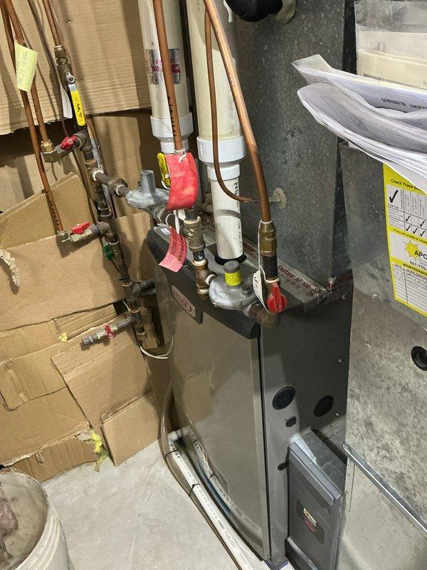 Responded to no cooling complaint on 12-year-old air conditioning system previously identified as low on refrigerant in April. Upon arrival, confirmed system was low on refrigerant and discovered indoor evaporator coil completely frozen, blocking all airflow to living space. Observed residual condensation leaking onto furnace cabinet, creating potential for secondary damage to heating equipment. System operating on obsolete refrigerant type. Set thermostat to off position and activated fan-only mode to initiate coil thaw process. Documented equipment condition with photographs showing HVAC installation and water damage concerns. Provided repair options via email and scheduled replacement system estimate. Confirmed furnace remains operational for heating needs during AC downtime.