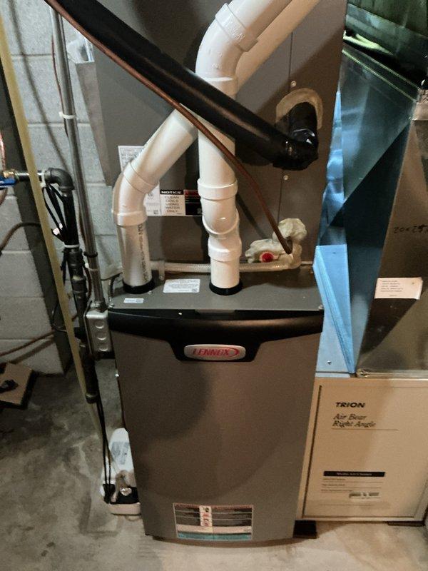 Completed preventive maintenance on 2-year-old heat pump system including condenser coil rinse and full system inspection. Unit operating within manufacturer specifications with all components functioning properly. Maintenance agreement service fulfilled per scheduled 8-12 AC tune-up protocol.