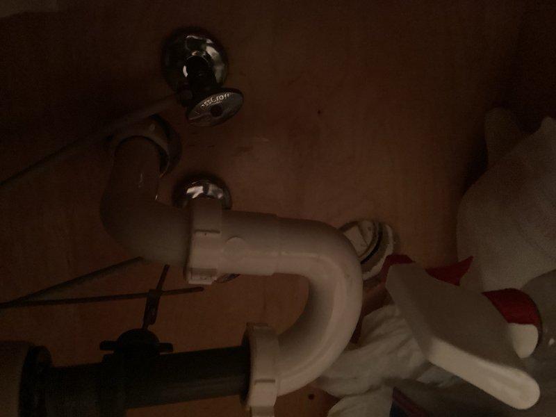 Completed annual plumbing inspection with emphasis on water heater evaluation. Inspected bathtub drainage system including trip waste assembly and overflow components, which are functioning properly. Examined under-sink plumbing including P-trap configuration and drainage lines with no leaks detected. Assessed 20-year-old water heater installed in 2005 and determined unit has exceeded typical service life expectancy. Prepared estimate for water heater replacement due to age and potential reliability concerns.