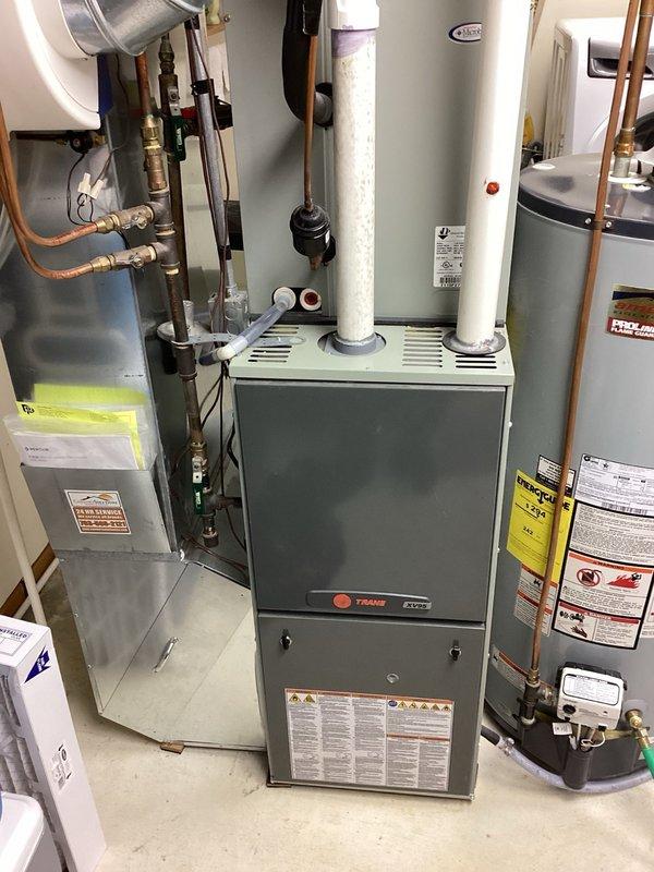 Completed comprehensive air conditioning tune-up on residential Trane HVAC system. Verified furnace filter had been recently changed and confirmed humidifier was properly shut down for the cooling season. Inspected dual capacitor rated at 40/7.5 MFD, which measured 40/7.15 MFD—readings indicate component is approaching end of service life and may require replacement in near future. All system components operating within normal parameters at time of service completion.