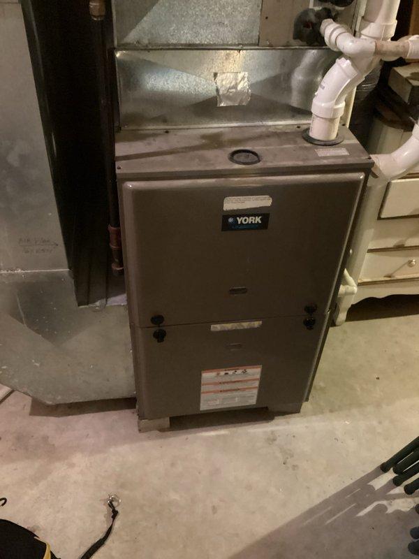Completed routine cooling maintenance on a 1999 Lennox condenser unit as part of a membership agreement. Performed comprehensive system evaluation including compressor amp draw testing, which revealed run amps on the high end indicating potential efficiency concerns. Verified capacitor readings within acceptable range and confirmed refrigerant charge at proper levels. Discovered and removed mouse nest from unit that posed electrical hazard risk. Replaced dirty air filter and measured temperature splits across the system. All measurements confirmed adequate cooling performance despite the age of the equipment. System operational but running below optimal efficiency due to elevated amperage readings and age-related wear. Final verification confirmed proper cooling function with acceptable airflow and temperature differential.