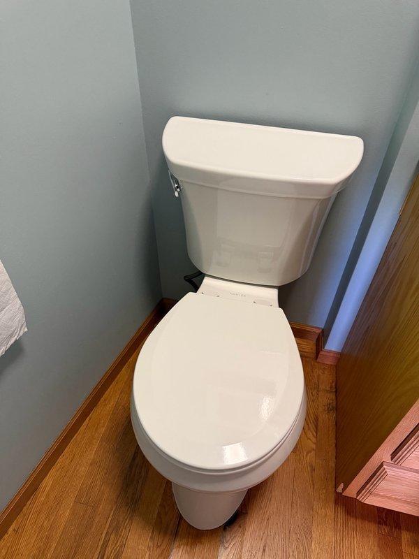 Installed new ADA-compliant comfort height toilet in men's restroom, including wax ring, mounting bolts, and complete fixture installation. Removed existing toilet and properly seated new unit to ensure proper seal and function. All components installed to manufacturer specifications and tested for proper operation.