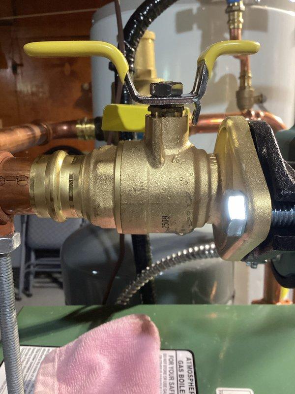 Responded to water leak on boiler installed in January. Upon inspection, identified loose brass fittings on ball valves connected to copper piping at the new installation. Tightened all compromised fittings and connections to restore proper seal and eliminate active leak.