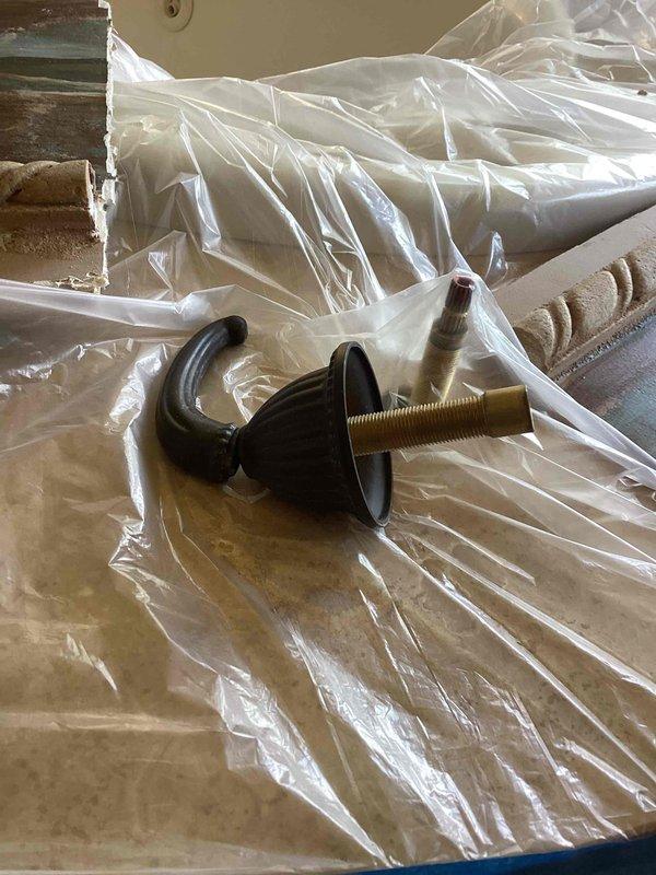 Responded to a plumbing emergency involving a pinhole leak beneath a jacuzzi tub that was causing water damage in the basement below. Upon inspection, identified that the valve body for the hot water handle was leaking. Shut off water supply to the tub to prevent further damage and allow the homeowner to proceed with drywall repairs. Documented the valve body failure, submitted parts order form for replacement components, and protected the work area with plastic sheeting during assessment and repair preparation.