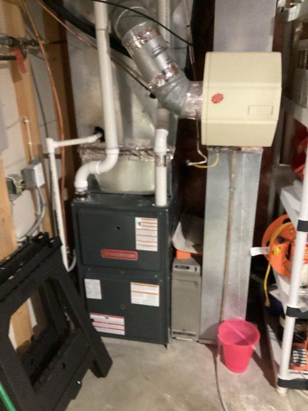 Completed preventive maintenance tune-ups on two residential air conditioning systems. Performed comprehensive inspections of both units, verified furnace filters had been recently changed, and confirmed humidifiers were properly shut down for the cooling season. Identified maintenance needs including drain line and drain spud replacement required for one humidifier system on future visit. Both HVAC systems tested and confirmed operational. Noted the older Goodman condensing unit exhibited slightly low refrigerant pressures, likely attributable to cooler ambient temperatures and minimal cooling load conditions. Advised homeowner to monitor cooling performance once outdoor temperatures increase and contact for service if cooling capacity appears diminished compared to previous season.