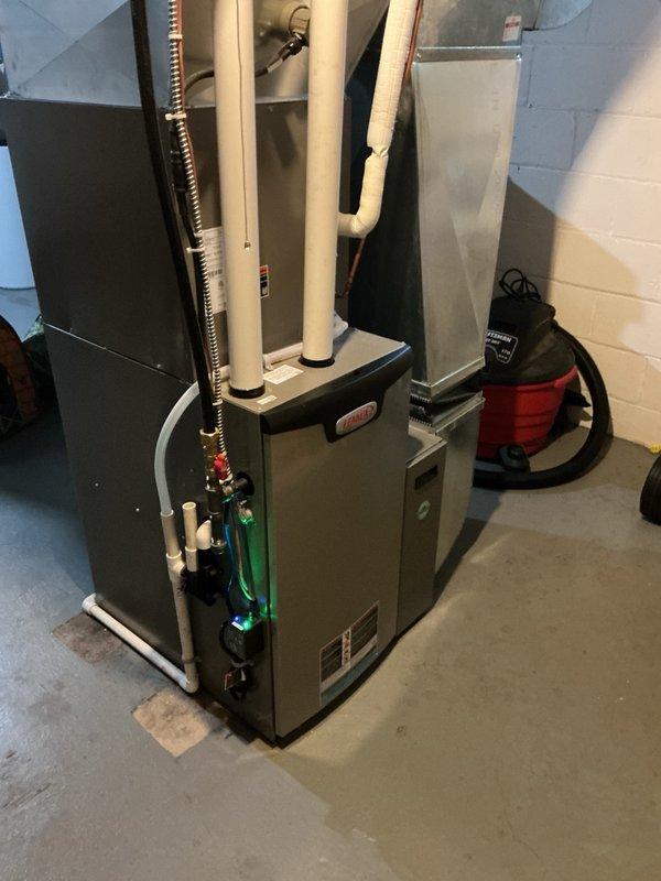 Performed comprehensive annual AC tune-up on 5-year-old system, verifying all indoor and outdoor components for optimal performance. Inspected furnace blower speeds and confirmed proper settings, checked air filter condition, tested all electrical components which measured within manufacturer specifications, performed coil cleaning by removing panels and rinsing condenser coils until clear, and flushed evaporator drain line to ensure proper drainage. Connected manifold gauges to verify refrigerant charge, confirmed system operating at proper levels with 22-degree temperature split across evaporator coil, and verified all components functioning correctly with no deficiencies noted.
