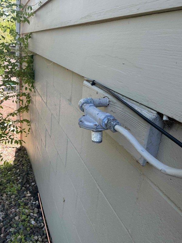 Responded to gas leak between meter and regulator caused by solar panel installation contractor drilling through copper gas line. Replaced damaged copper line section with new pipe and fittings. Replaced gas regulator that had been improperly positioned during solar work. System tested and restored to safe operation.