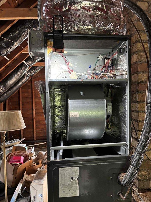 Completed annual cooling maintenance on one 5-6 year old R-410A air conditioning system including condenser and air handler inspection. Performed comprehensive system evaluation including filter, thermostat operation, temperature differential, condenser unit, evaporator and condenser coils, blower motor, capacitors, compressor function, refrigerant charge levels, and condensate drain line. All mechanical and electrical components found operating within normal parameters at 52°F ambient temperature. Recommended 14x25x1 filter replacement. Investigated ongoing condensation issue on upper level ceiling reported from previous year. Inspected attic-mounted air handler and suction line insulation, confirming proper insulation on refrigerant lines with no moisture present. Identified lack of adequate attic insulation as primary contributing factor to condensation formation. Recommended installation of attic insulation in affected area and installation of dehumidifier to control indoor humidit