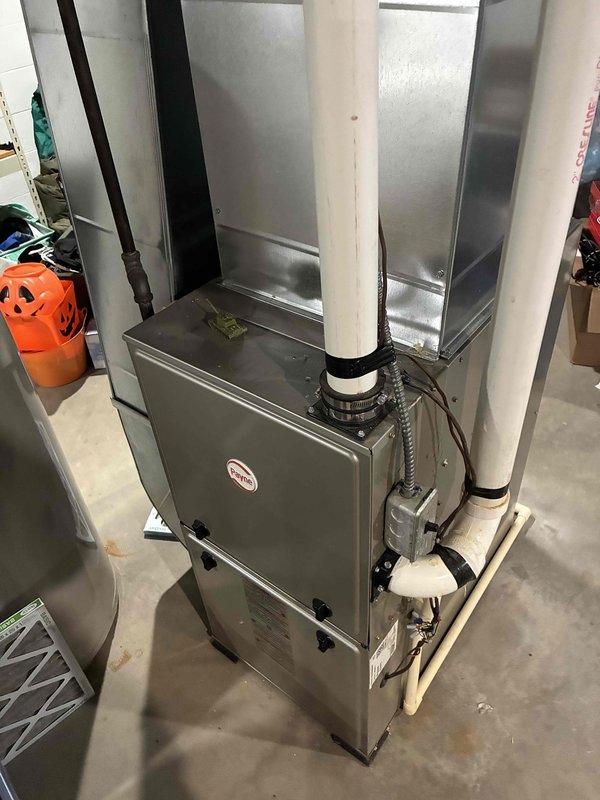 Performed preventative maintenance on aging R-22 air conditioning system. Inspection revealed low refrigerant pressures with suction pressure below 50 PSI and temperature differential in the 14-16 degree range, indicating potential refrigerant loss. Contactor exhibited buzzing due to pitted contacts, though capacitor tested within acceptable range. Cleaned condenser coil and completed system evaluation. Due to the unit's age, obsolete R-22 refrigerant, and failing contactor, recommended full system replacement rather than investing in repairs. Homeowner agreed with assessment and replacement recommendation was scheduled for further consultation.