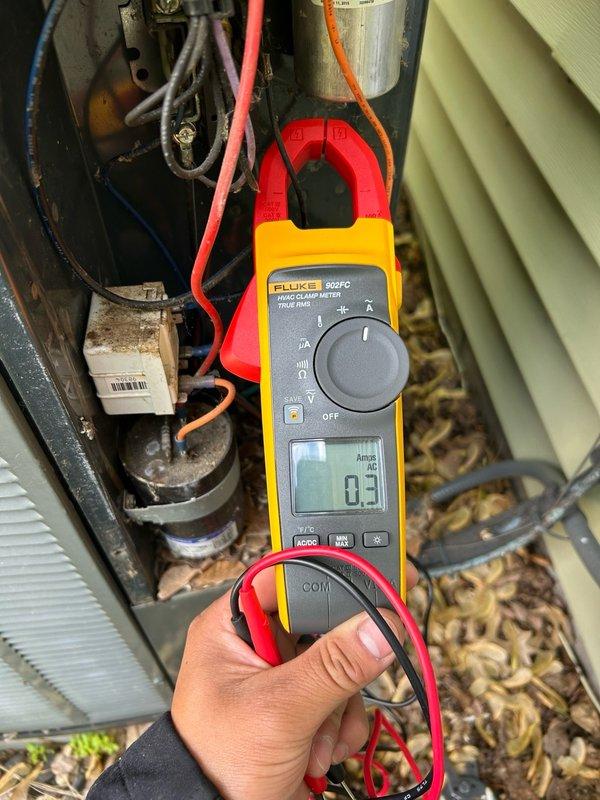 Responded to a no-cooling complaint on a 10+ year old air conditioning system that had been running continuously for 9 hours. Upon arrival, performed comprehensive inspection of the evaporator coil and heat exchanger, finding no major cracks or damage, though minor spotting was noted on both interior and exterior surfaces of the heat exchanger. Proceeded to outdoor condenser unit and discovered absence of 240V power supply. Traced electrical issue to indoor breaker which was found in the off position. After restoring power to the system, conducted diagnostic testing and identified a failed run capacitor as the root cause of the malfunction. Replaced the defective capacitor with new component and verified compressor operation. Confirmed system cooling performance with refrigerant pressure readings now within manufacturer specifications and proper operating range. Unit restored to normal cooling operation.