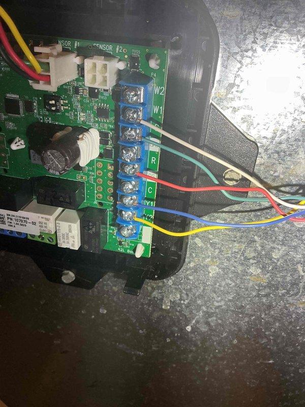 Responded to no heat call on 3-year-old furnace following recent AC installation. Upon inspection, identified thermostat wiring error at furnace control board where heating call wire was incorrectly terminated to W2 terminal instead of W1 terminal. Corrected wiring configuration by relocating wire to proper W1 terminal on control board. Verified furnace operation and confirmed heating system responding properly to thermostat calls.