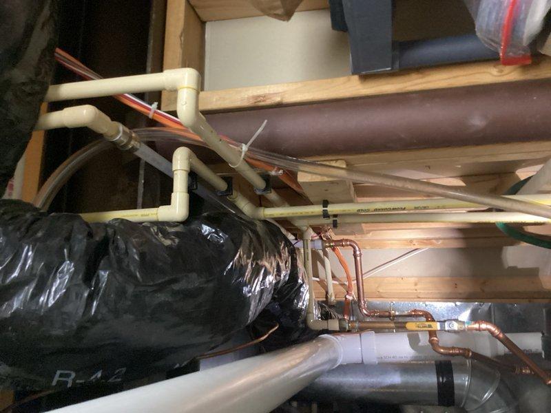 Responded to call for water heater leaking from bottom with intermittent hot water issues. Upon inspection, determined the leak was not originating from the water heater unit itself, but from failed CPVC piping located above the water heater in the joist cavity. Replaced the defective CPVC section with new piping and fittings to restore proper system integrity and eliminate the leak.