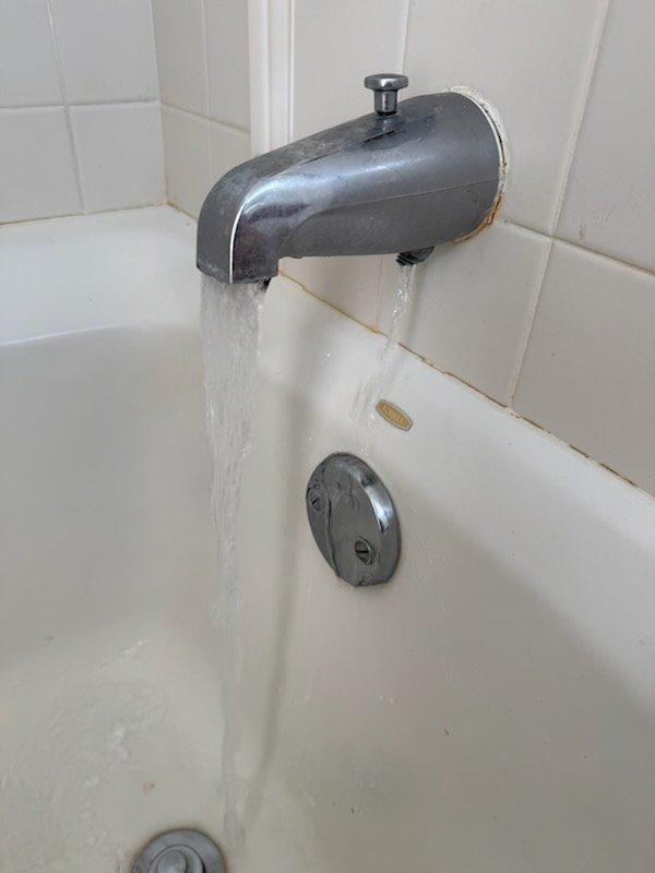 Conducted comprehensive plumbing assessment for multiple fixture repairs and replacements. Evaluated toilet for replacement, inspected bathtub spout showing signs of wear and potential water intrusion at wall interface, assessed three exterior hose spigots requiring replacement, and diagnosed shower hot water delivery issue previously identified as a potential in-wall piping problem rather than valve assembly malfunction. Documented all findings photographically and prepared detailed written estimates for toilet replacement, tub spout replacement, hose spigot replacements, and shower system repair to address the temperature control issue.