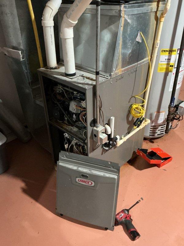 Performed AC inspection and tune-up on residential Lennox system for insurance assessment following hail damage to outdoor condensing unit. Evaluated condenser coil damage and determined that while minor fin damage is present, the majority of coils remain functional with only a couple of severely bent sections that are not repairable. System is currently operational and cooling adequately despite cosmetic damage. Unit operates on R-22 refrigerant, which is now obsolete with limited parts availability and high service costs for future repairs. Discussed potential unit relocation requirements due to planned deck addition and door installation adjacent to current condenser placement. Provided consultation on repair versus replacement options, noting that given the age of equipment, R-22 phase-out, and hail damage, replacement with modern equipment may be more cost-effective long-term solution than attempting coil repairs. Documented equipment condition with photographs of both indoor furn