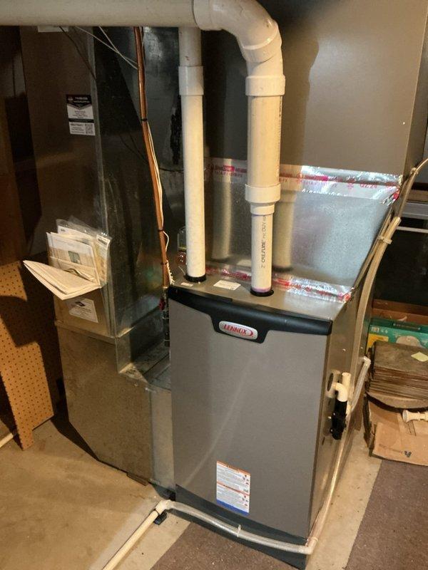 Responded to service call for air conditioning system not maintaining adequate cooling during hot weather conditions. Upon arrival, performed comprehensive AC tune-up and diagnostic evaluation of the cooling system.

Activated heating system to raise indoor temperature to 74 degrees to establish proper conditions for accurate refrigerant pressure and temperature measurements. Conducted refrigerant charge analysis, which indicated levels were within acceptable parameters.

Performed electrical diagnostics on outdoor condensing unit. Observed compressor operating with elevated amperage draw and excessive noise levels during operation. Inspected capacitor connections, noting significant corrosion and deterioration on terminal points with evidence of oxidation and burnt material around connection posts. Capacitor housing showed weathering consistent with extended outdoor exposure.

Monitored system performance metrics and identified concerning operational patterns. Vapor saturation tempera