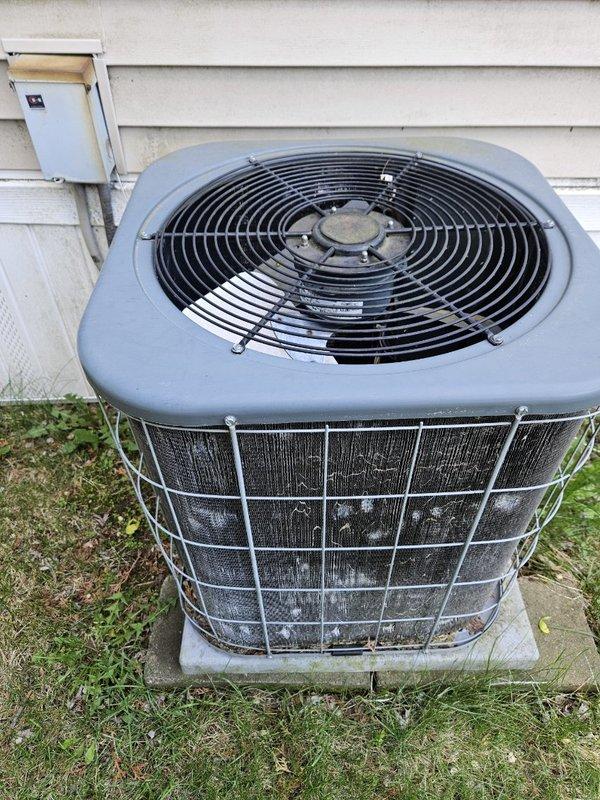Performed preventive maintenance on 2005 R22 air conditioning system. System pressures measured within acceptable range with an 18-degree temperature differential across the evaporator coil. Capacitor and contactor tested and confirmed operating within manufacturer specifications. Condenser coil manually cleaned using brush method due to non-functional water supply at property; coil condition was relatively clean prior to service. Recommended system replacement due to obsolete R22 refrigerant, but customer declined at this time. Unit operating properly with no additional concerns noted.