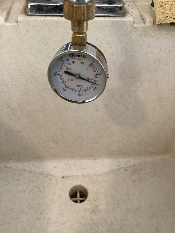 Completed biannual plumbing inspection including flushing three water heaters, inspecting water softener, sump pump, and laundry hoses. Performed comprehensive leak detection throughout the property and checked all exterior faucets for seasonal operation. All systems found to be functioning properly except the main shut-off valve, which requires replacement. Submitted estimate request for valve replacement. Documentation includes photos of shower fixtures and pressure testing equipment.