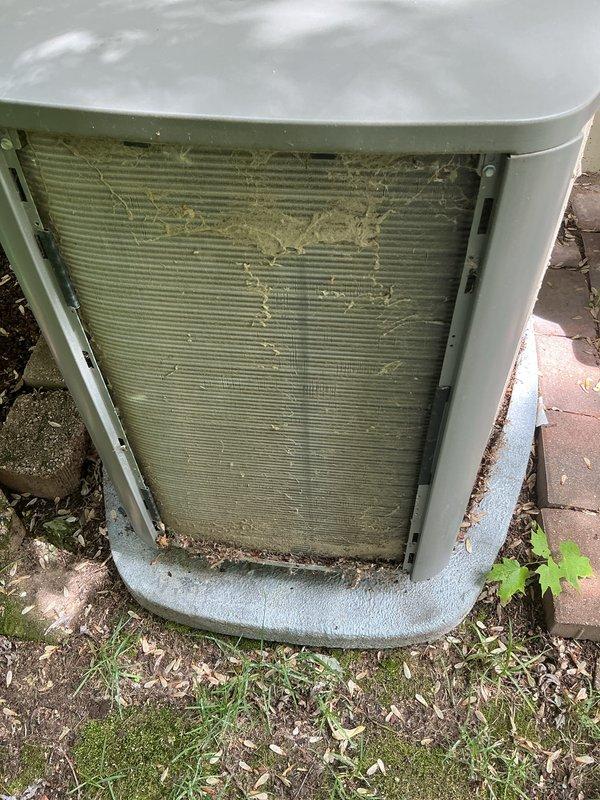 Completed comprehensive AC maintenance tune-up on 6-year-old system per maintenance agreement. Outdoor condenser coil was heavily soiled with organic debris, leaves, dirt, and plant matter; thoroughly cleaned coil fins to restore proper airflow and heat transfer efficiency. System operational with no additional concerns noted.